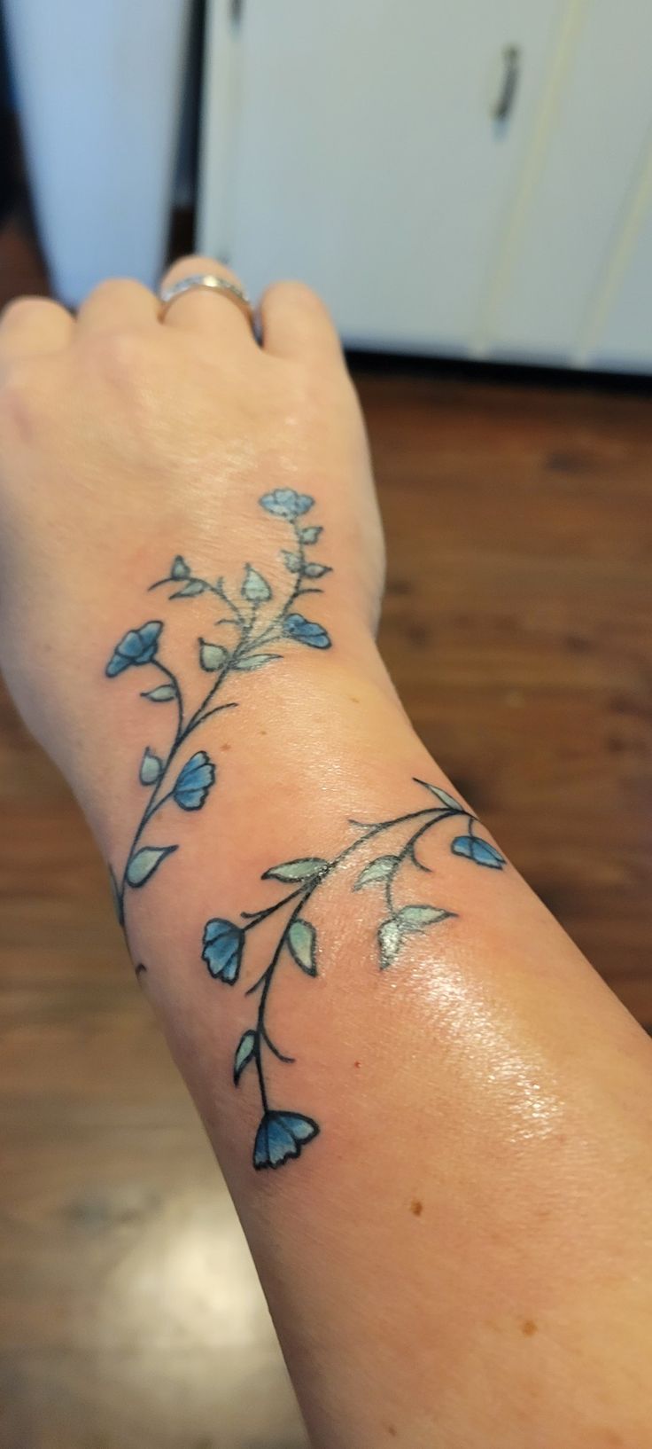 Ivy tattoo with flowers