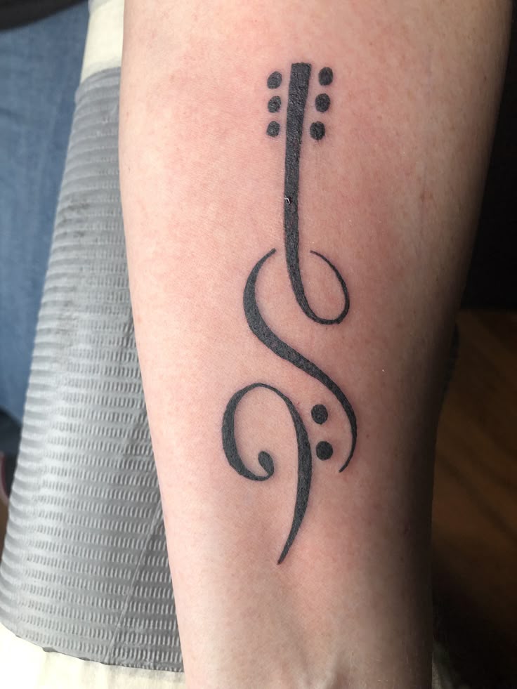Guitar and music tattoo