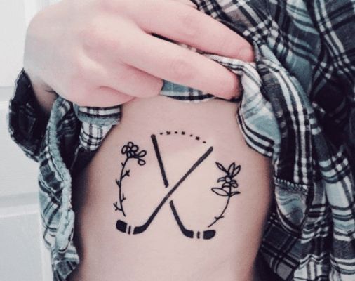 Floral hockey stick tattoo