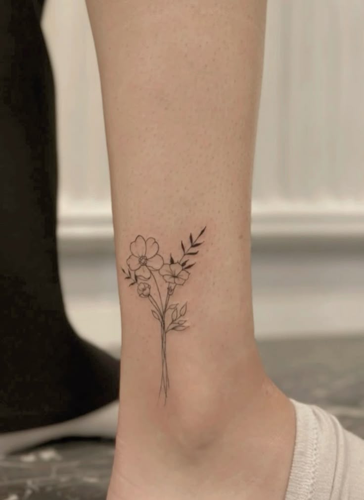 February and September birth flower bouquet tattoo