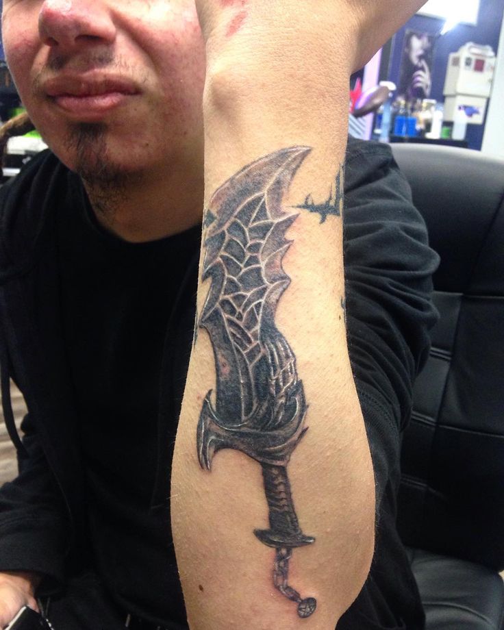 Black of Chaos from God of War arm tattoo