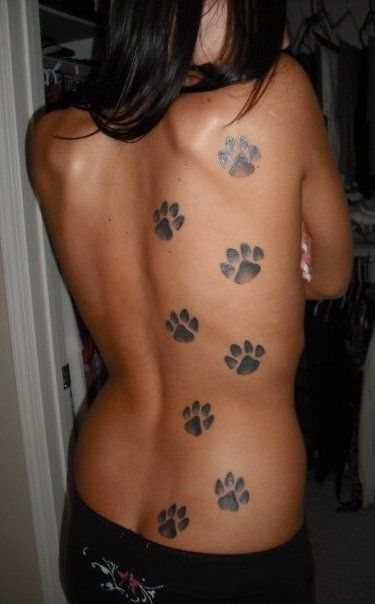 Wouldn't go all the way with this but I love it. My tattoo of dog paws in  symbol of Animal Rights