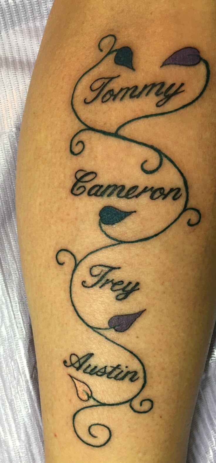 My second tattoo honoring my late brother & my three children, in birth  order. The leaves represent their birthstones ❤️ Done on Sept 3, 2016