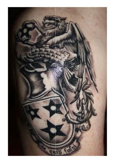 Amazing family crest tattoo