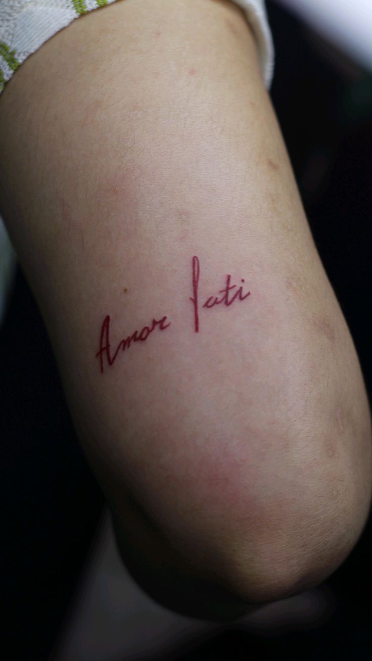 Amor Fati Tattoo In Red Ink