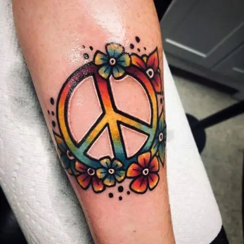 15 Best Peace Tattoo Designs To Enhance Your Beauty! | Peace sign tattoos,  Hippie tattoo, Peace tattoos