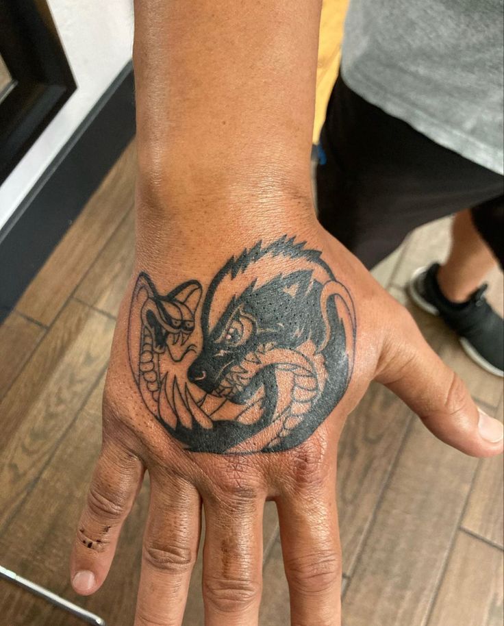 Honey badger hand tattoo
