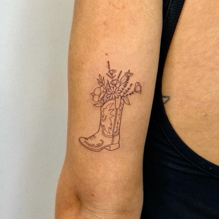 Cowboy boots tattoo